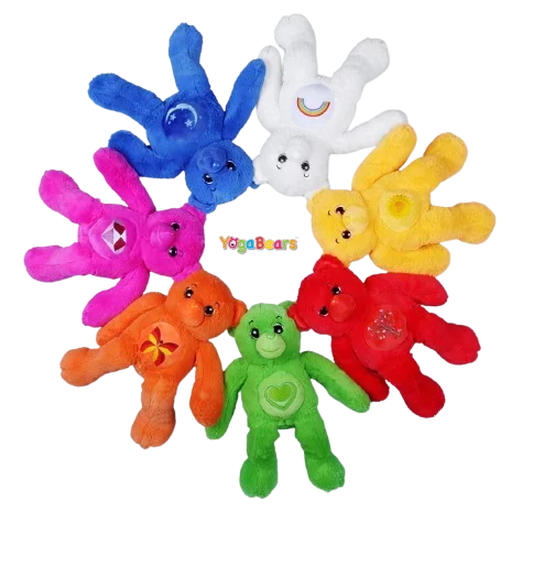 The seven YogaBears plush characters arranged in a circle
